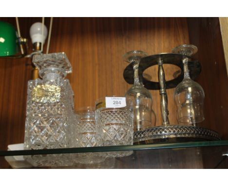 A BOHEMIA CRYSTAL WHISKEY DECANTER AND TUMBLERS TOGETHER WITH A SILVER PLATED WINE GLASS HOLDER ETC.