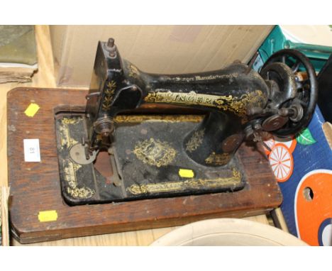 A VINTAGE SINGER SEWING MACHINE