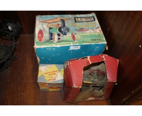 A BOXED VINTAGE MAMOD TRACTION ENGINE TOGETHER WITH A BOXED MAMOD MINIATURE GRINDING MACHINE AND A MINER ONE STEAM ENGINE