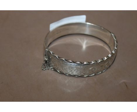 A HALLMARKED SILVER BANGLE
