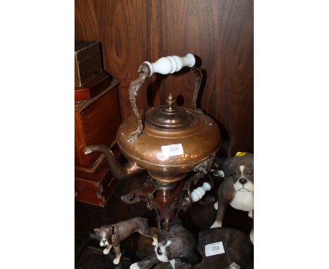 A VINTAGE COPPER SPIRIT KETTLE ON CAST STAND