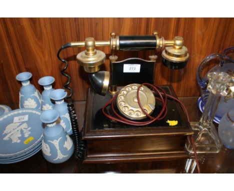 A VINTAGE TELEPHONE ON STAND