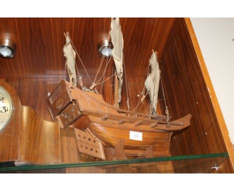 A VINTAGE ORIENTAL MODEL OF A SAIL SHIP WITH ORIENTAL MARKINGS TO THE STERN