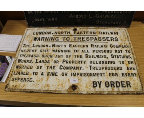 A LARGE VINTAGE CAST IRON LONDON NORTH EASTERN RAILWAY SIGN 'WARNING TO TRESPASSERS'
