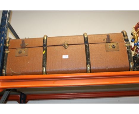 A LARGE BROWN VINTAGE TRUNK