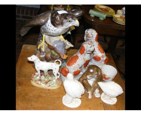 A large ceramic Eagle ornament, together with a Staffordshire Dog, etc. CONDITION REPORTEagle has breakslight crack at top of