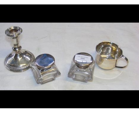 A silver candlestick, beaker, etc. 