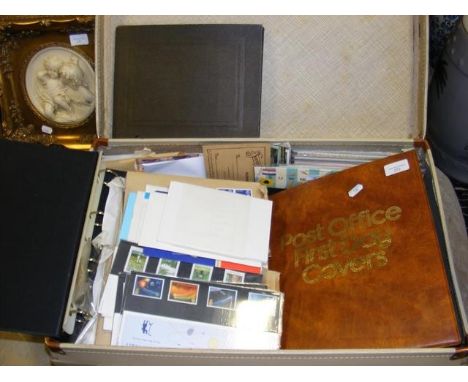 A suitcase containing a large selection of First Day Covers and stamps 