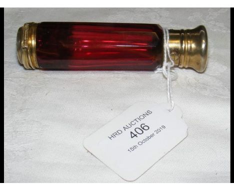 A 19th century ruby glass scent bottle with gilt metal lid and vinaigrette base, by Maw &amp; Thompson  