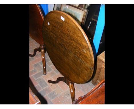 A Georgian oak tripod table - 66cm diameter 