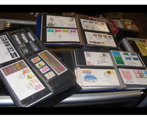 Three albums of First Day Covers and presentation packs - mainly GB 