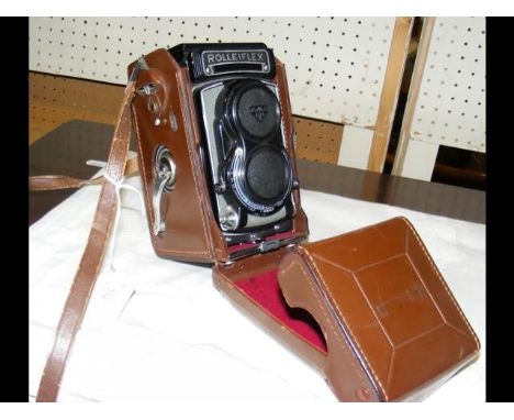 A Rolleiflex Camera in leather case 