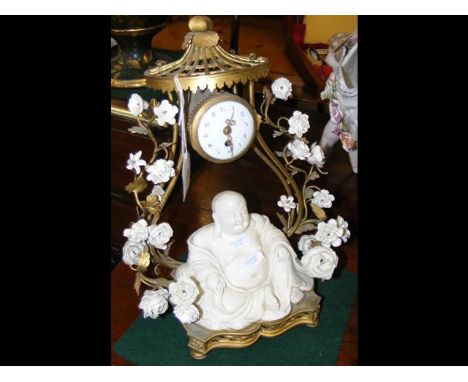 Antique oriental 'Buddha' clock, having gilt metal pagoda and ceramic flowers to the frame - 30cm high CONDITION REPORTAs per