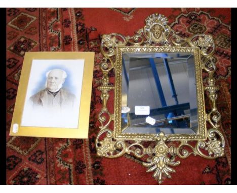 Decorative brass framed wall mirror, together with a portrait of Gladstone 