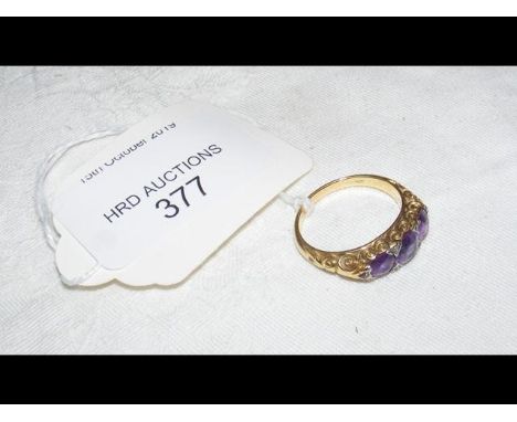 An amethyst and diamond ring in 18ct gold setting  