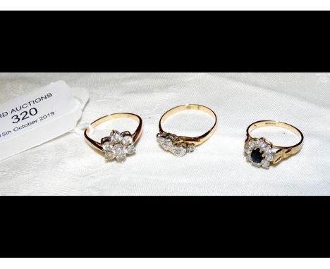 A lady's 9ct gold dress ring, together with two others 