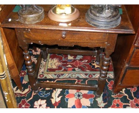 A period side table with single drawer on bobbin supports  