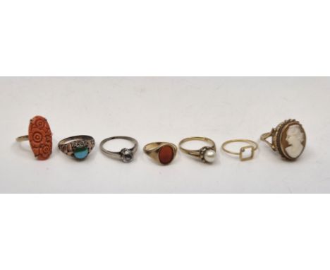 A 9ct. gold and carved coral ring, size UK N 1/2 (gross weight 2.8g), together with a 9ct. gold and carnelian signet ring, UK