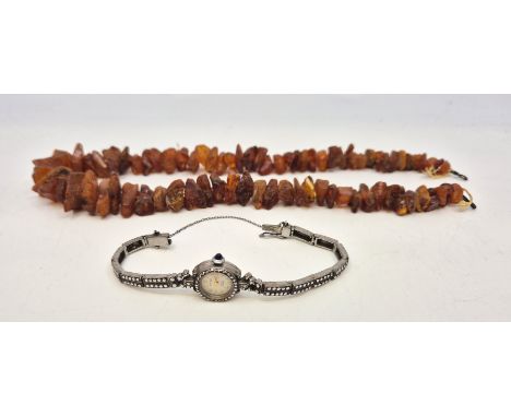 A Rotary silver and marcasite set cocktail watch, movement currently not working, together with an amber necklace, length 46c