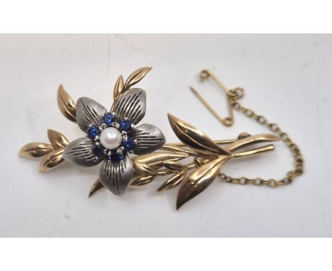 A 9ct. bi-colour gold, sapphire and cultured pearl floral spray brooch,&nbsp;having engraved brushed finish 9ct. white gold p