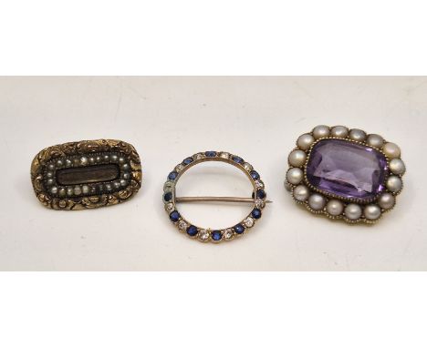 A precious yellow metal, sapphire and diamond wreath brooch, the lobed ring form mount set alternating round cut sapphires an