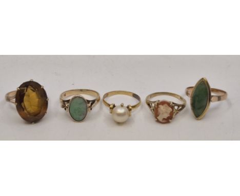 A 9ct. gold green nephrite jade ring, marquise mount with cabochon nephrite in rub-over setting, size UK N, together with ano