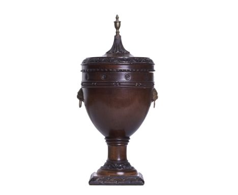 Adams style A mahogany and ormolu urn With lion's head handles and pointed brass finial&nbsp;  Dimensions:&nbsp; 12 in. (H) x