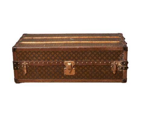 Louis Vuitton Early 20th Century A monogram canvas 'Malle Armoire' wardrobe trunk Brass studded wooden slats to the lid, the 