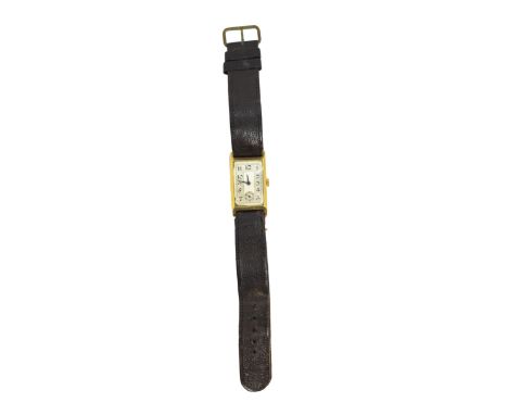 Swiss Circa 1930 An 18 carat gold gentleman's wristwatch The silver dial with stylised black enamel numerals and subsidiary s