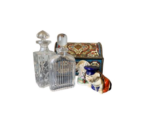 20th Century An eclectic selection of objets [a] Two cut glass decanters [b] Five tobacco pipes, with a leather pipe rack [c]