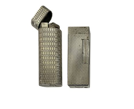 Dunhill and Cartier Vintage Two lighters in silver  Property of a nobleman  Dimensions: (Dunhill) 2.5 in. (H) x 1 in. (W) x 0