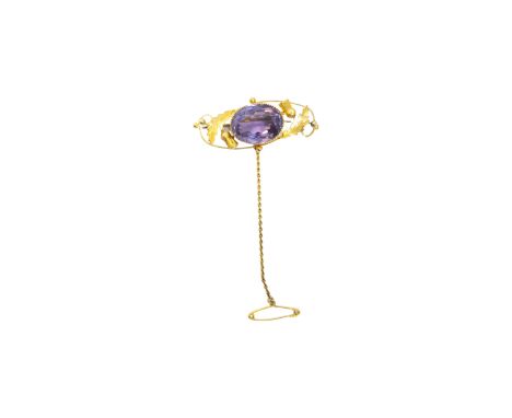 British Circa 1880 An amethyst and yellow gold brooch The oval shaped central mixed-cut amethyst set within a yellow gold thi