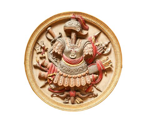19th Century A pair of large painted roundels The central design comprising a Roman military costume mounted atop a trunk in 