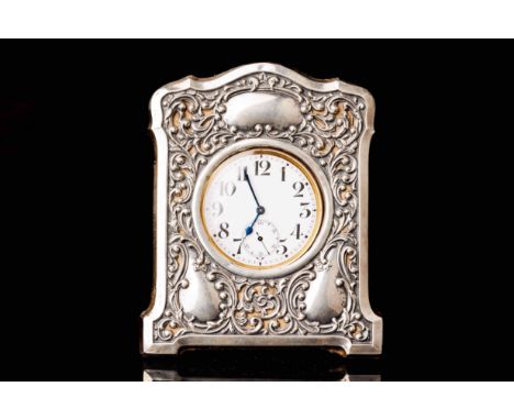 Swiss clock, silver plated metal. Pocket watch by Doxa. The clock is set in a beautiful silver frame. The frame has the Engli