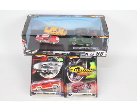 Hot Wheels - 6 x cars in 1:50 scale, a display box of four 'Soul of '68' Ford Mustang set # M7751, a carded '69 Dodge Charger