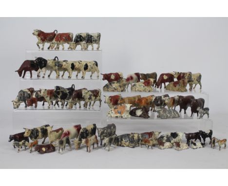 Britains, Timpo, Johillco, Similar - A herd of approximately 58 various cattle types by Britains and similar. Lot includes co