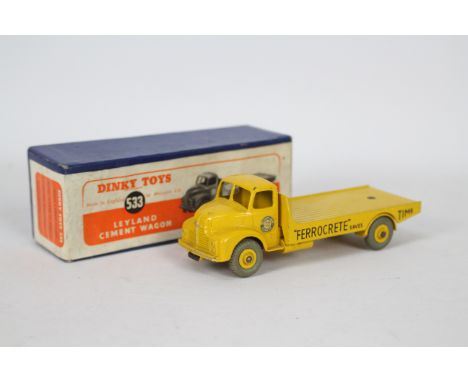 Dinky - A boxed Leyland Cement Truck in Ferrocrete livery # 533. The model appears in Very Good condition with some light sig