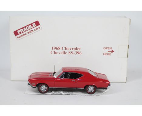 Danbury Mint - A boxed 1:24 scale 1968 Chevrolet Chevelle SS-396 by Danbury Mint. The model appears to be in Very Near Mint c