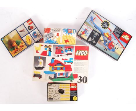 A collection of 5x assorted boxed vintage Lego sets. To include box numbers; 880, 812, 802 and 884. Each filled, but contents