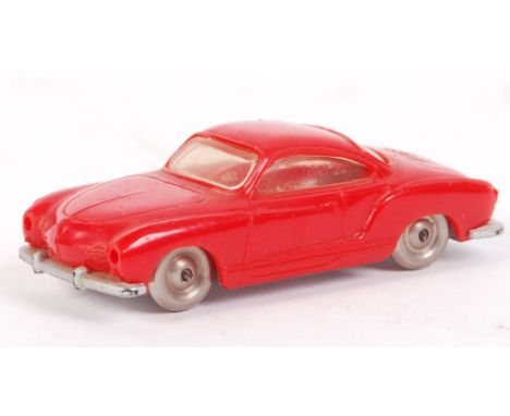 An original vintage 1950's Lego ' Karmann Ghia ' plastic model car in red. Retaining all the original metal wheels. Measures 
