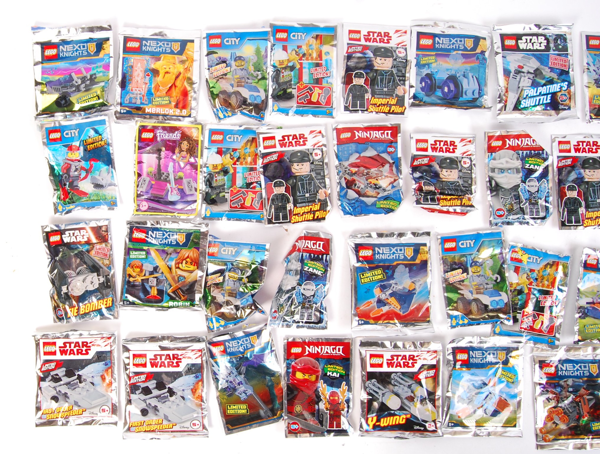 A large collection of approx 75x Lego poly bag sets for various series ...