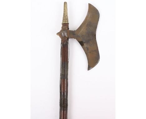 Indian Tribal Axe, 19th century, from Chota Nagpur, moustache-shaped blade 23cms, on its wooden haft with brass mounts and wi