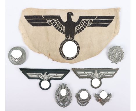 WW2 German Insignia Grouping, consisting of bevo German army sports vest eagle, M-36 and M-40 pattern NCO’s combat tunic flat