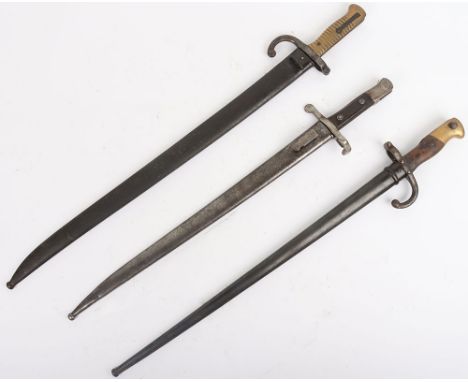 French Chassepot Rifle Bayonet, with brass ribbed grip, yataghan blade and housed in its steel scabbard; French Gras Rifle ba