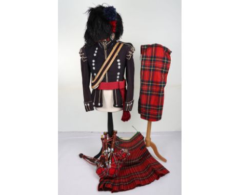 EIIR Scots Guards Pipers Full Dress Uniform, being a dark blue highland cut away doublet tunic with anodised regimental butto