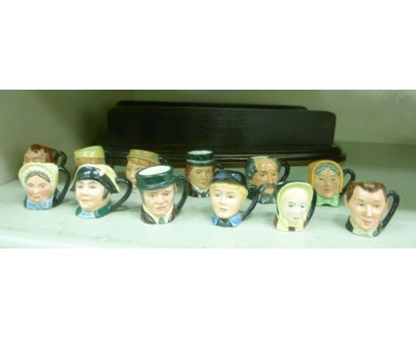 A set of twelve Royal Doulton china, miniature Dickens Ware character jugs: to include 'Mr Bumble' and 'Betsy Trotwood', disp