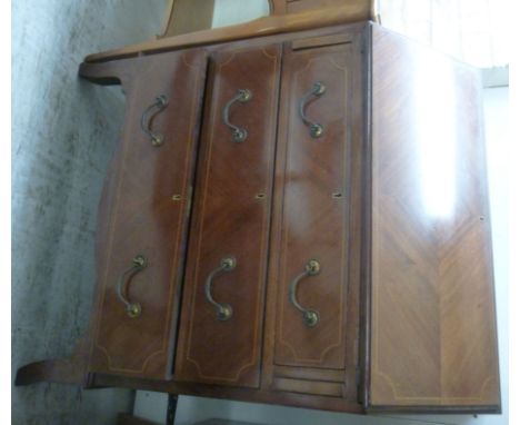 An Edwardian ebony and string inlaid mahogany bureau, having a fall flap, over three drawers, raised on bracket feet  39''h  