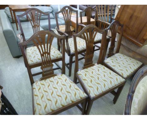 A set of six 1920s mahogany framed, pierced splat-back dining chairs, the tapestry upholstered drop-in seat raised on chamfer
