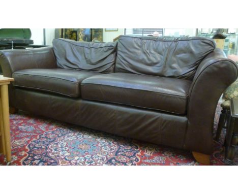 A modern three seater settee, having a level back and scrolled arms, upholstered in stitched, soft, chocolate brown hide with