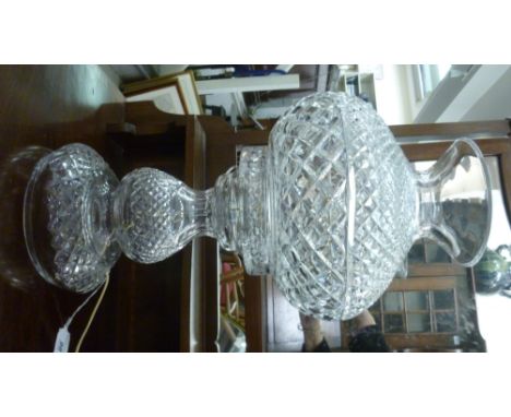 A Waterford crystal two part table lamp with diamond and slice decoration, having a bulbous shade with a flared rim, on a gou